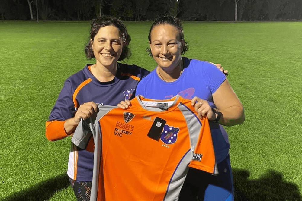 Christina Ovenden (right) presented with her Victorian refereeing jersey