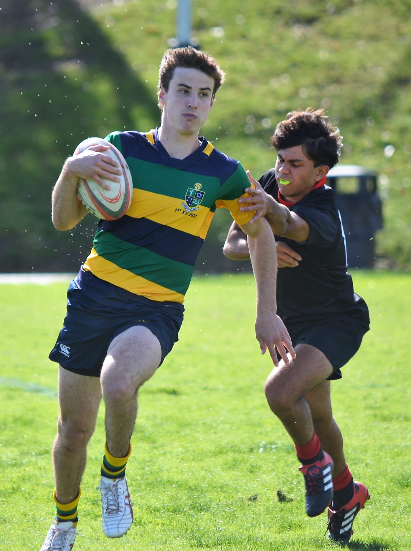 St Kevins evades a tackle