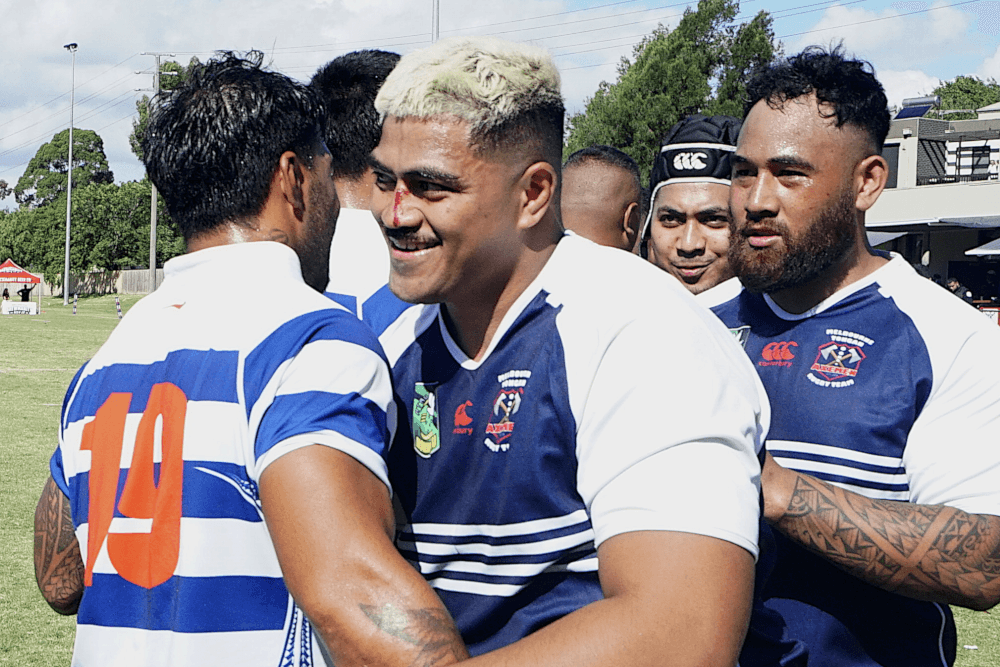 Tongan and Samoan players come together after a ding-dong battle